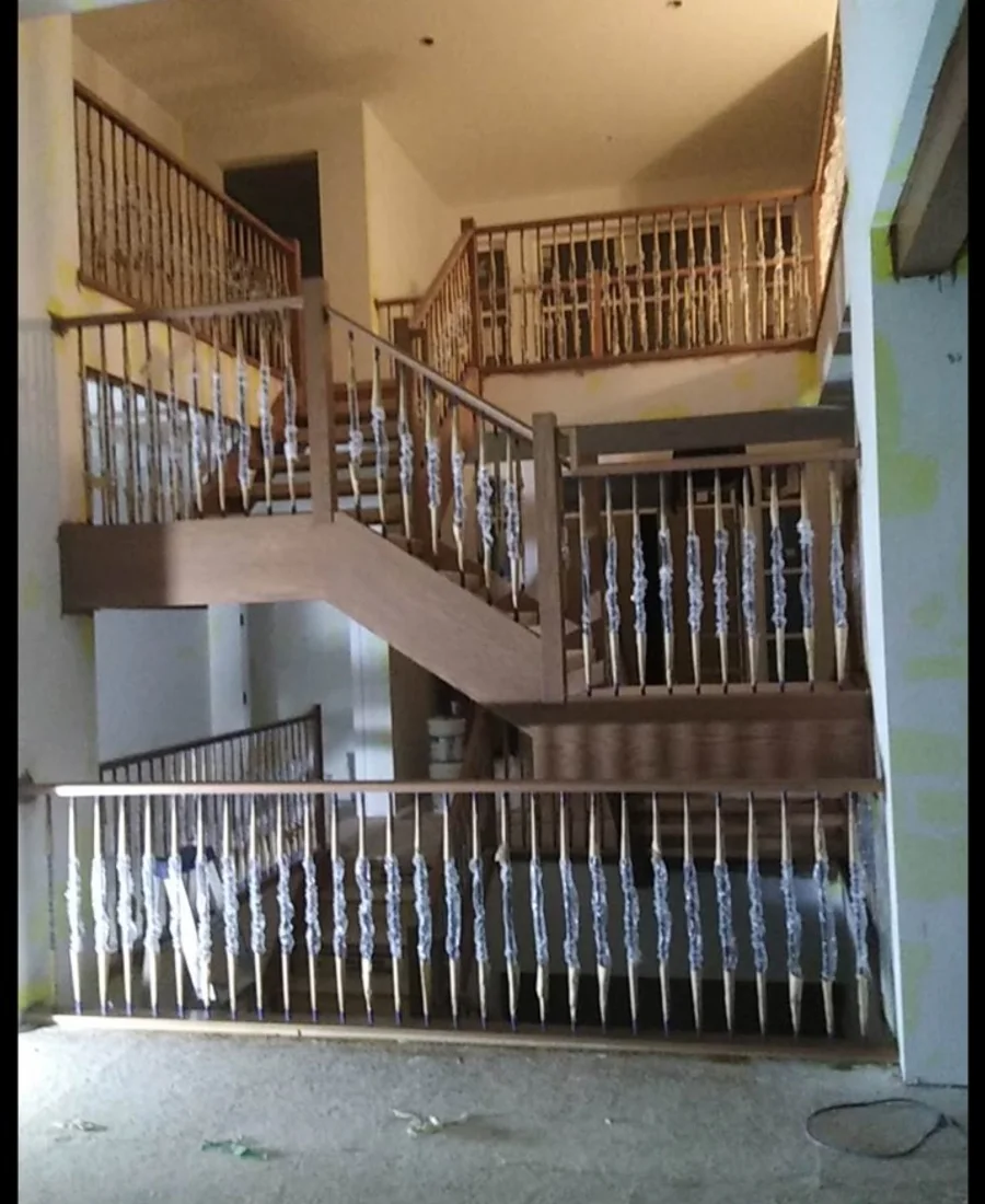 Interior staircase and railings prepared for painting